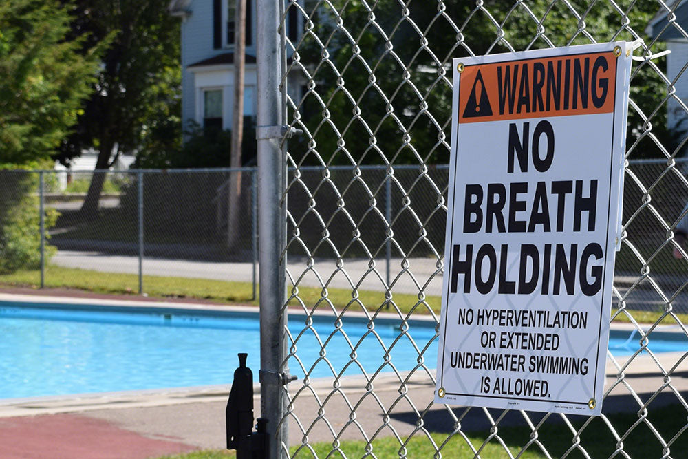 No Breath Holding Warning Sign in Spanish - 12 x 18 Inches on Styrene Plastic
